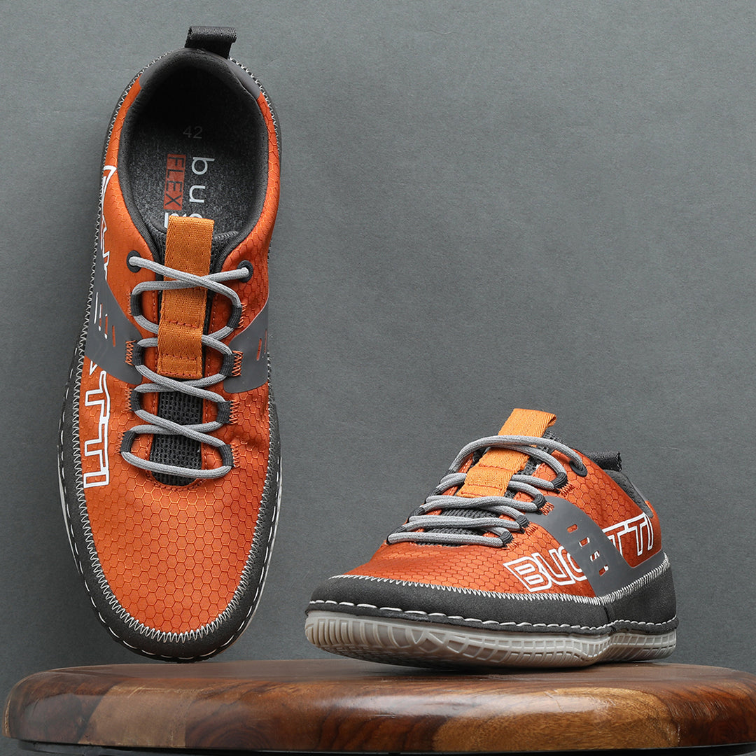 A grey Men's bugatti Sneakers featuring a round plain toe, zero heels heel. Made from textile with a durable tpr outsole, this laces design offers both style and comfort.