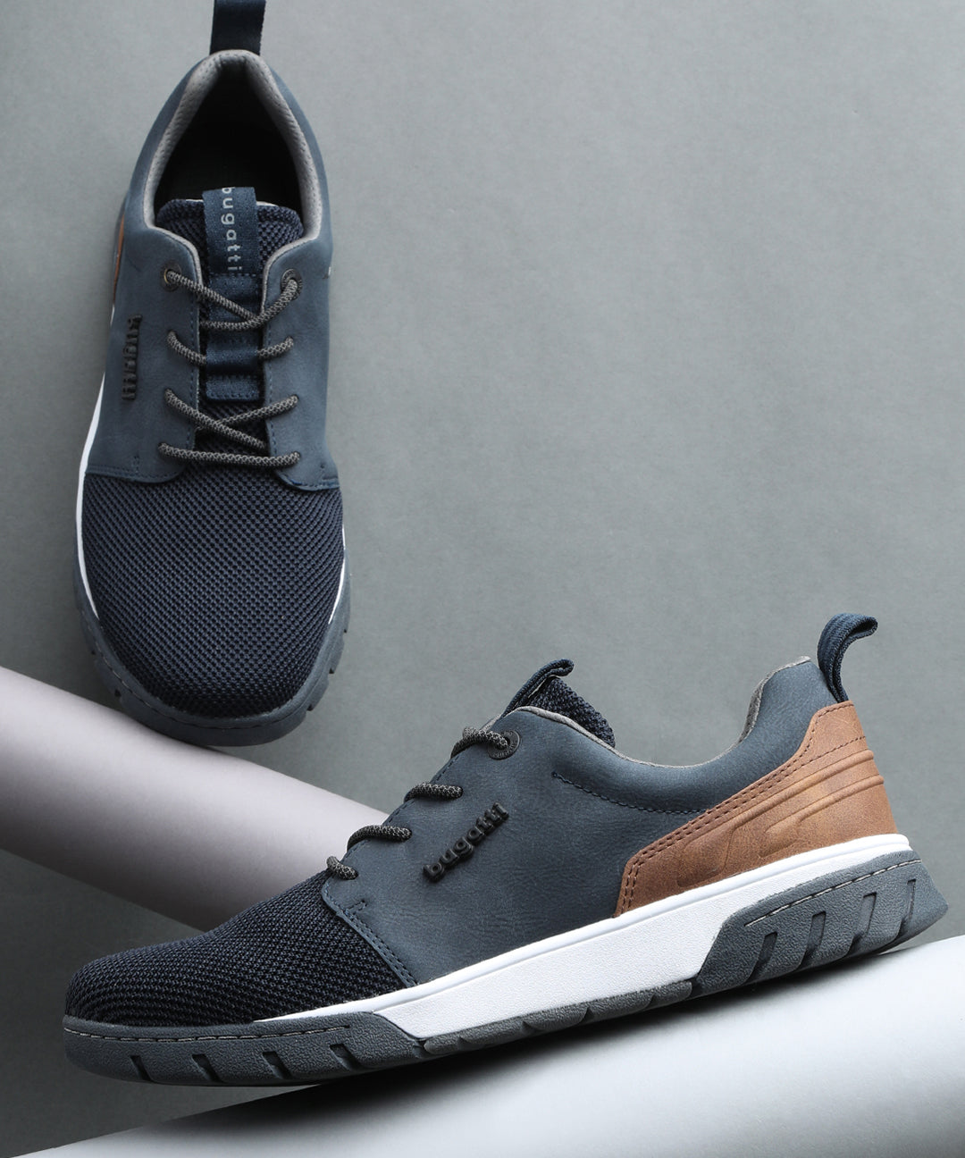 A blue Men's bugatti Sneakers featuring a round plain toe, zero heels heel. Made from textile with a durable eva outsole, this laces design offers both style and comfort.