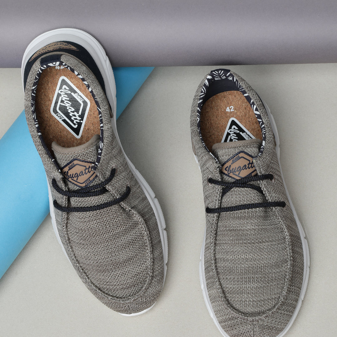 A beige Men's bugatti Sneakers featuring a round plain toe, zero heels heel. Made from textile with a durable eva outsole, this laces design offers both style and comfort.