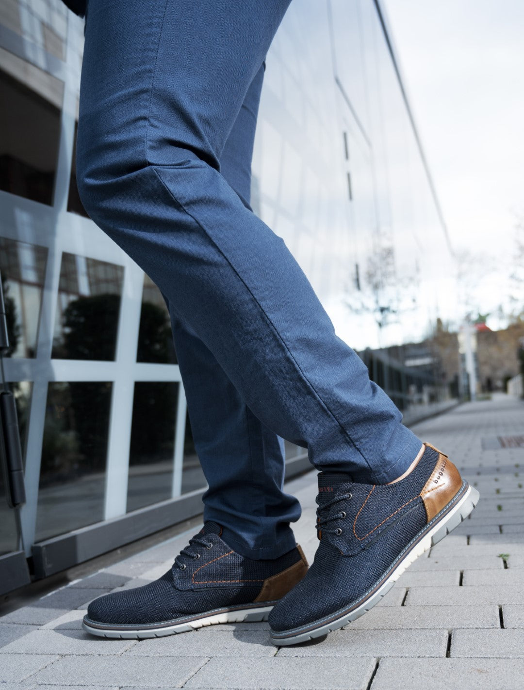 A blue Men's bugatti Derby featuring a pointed plain toe, zero heels heel, and a wide fit. Made from textile with a durable tpr outsole, this laces design offers both style and comfort.