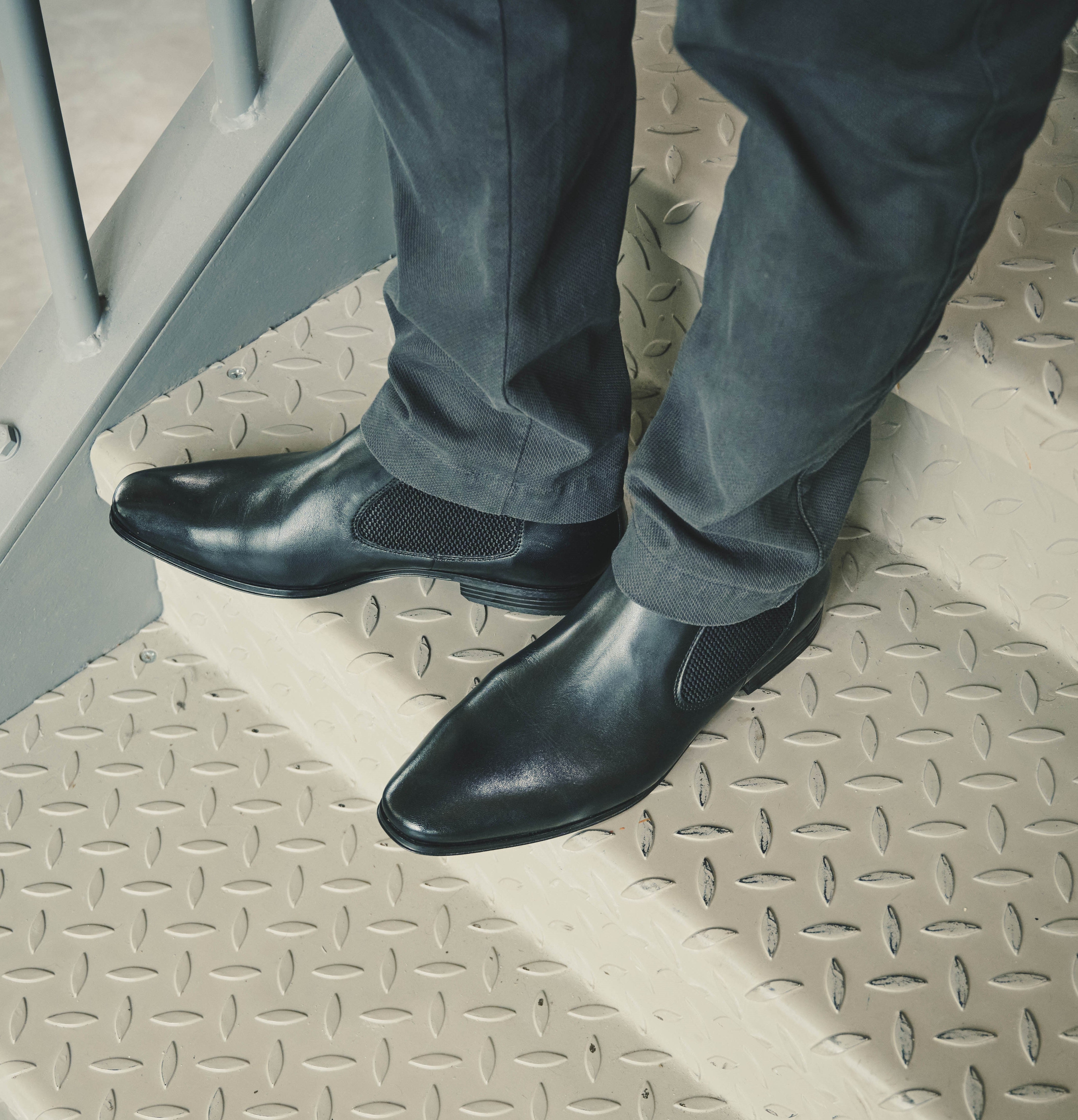 A black Men's bugatti  Chelsea Boots featuring a round toe plain toe, stacked heel. Made from premium genuine leather with a durable tpr outsole, this elastic design offers both style and comfort.