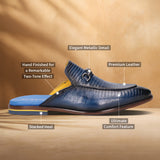 A blue Men's bugatti Mules featuring a round apron toe, stacked heel. Made from premium genuine leather with a durable leather outsole, this slip-on design offers both style and comfort.