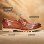 A cognac Men's bugatti Penny Loafer featuring a round apron toe, stacked heel, and a extra wide fit. Made from premium genuine leather with a durable eva outsole, this slip-on design offers both style and comfort.