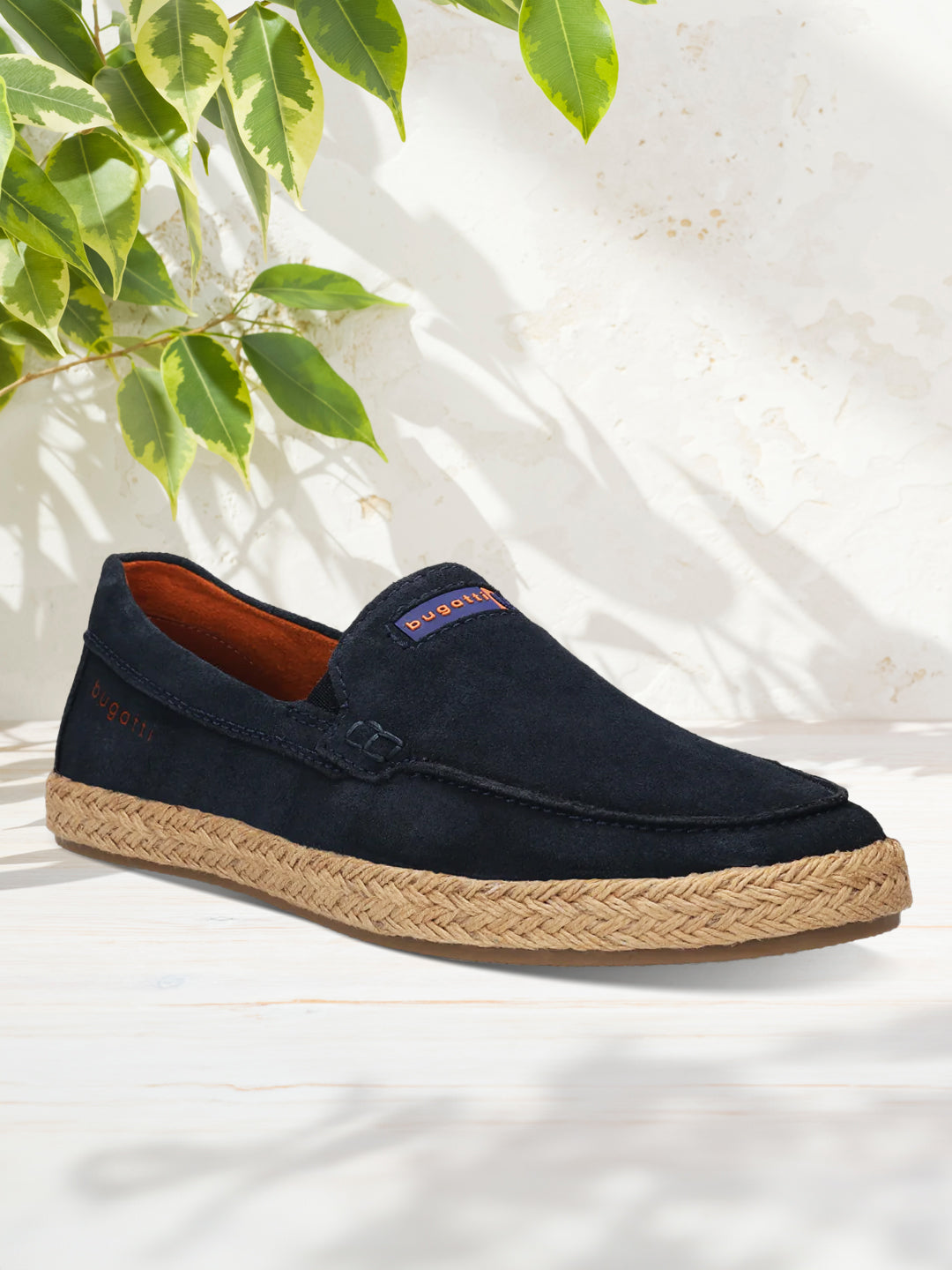 A blue Men's bugatti Casual Loafers featuring a round toe apron toe, zero heels heel. Made from premium genuine leather with a durable tpr outsole, this slip-on design offers both style and comfort.