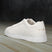A white Men's bugatti Sneakers featuring a round toe plain toe, zero heels heel. Made from premium genuine leather with a durable tr outsole, this laces design offers both style and comfort.