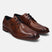 A cognac Men's bugatti Derby featuring a round plain toe, stacked heel. Made from premium genuine leather with a durable leather outsole, this laces design offers both style and comfort.