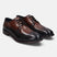 A brown Men's bugatti Brogue featuring a round wingcap, stacked heel. Made from premium genuine leather with a durable leather outsole, this laces design offers both style and comfort.