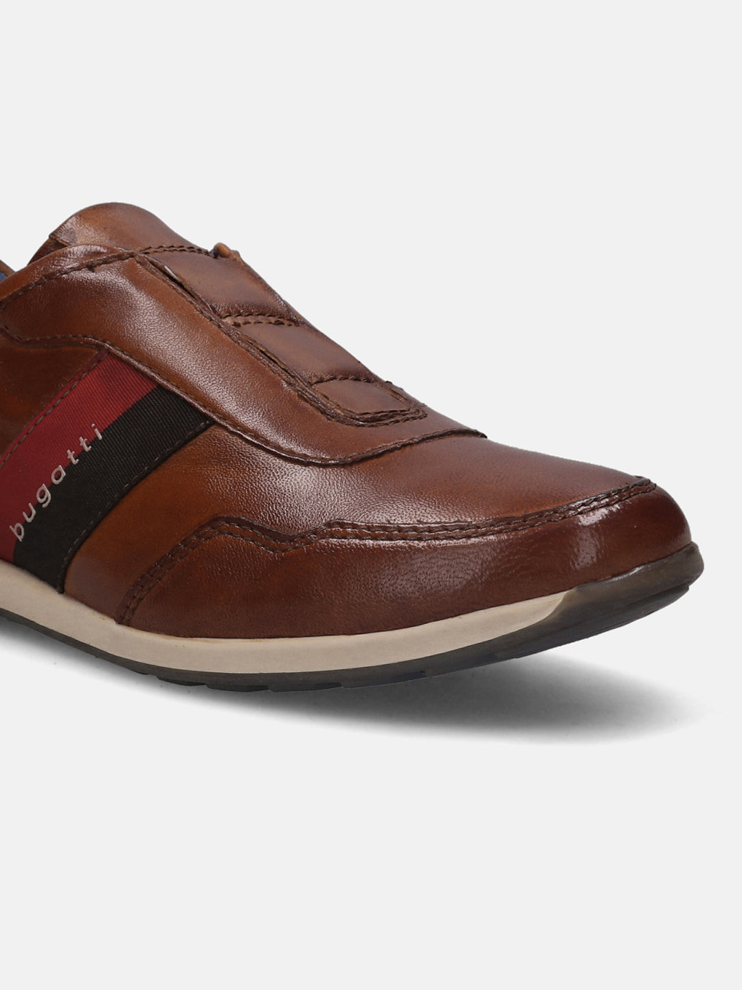 A cognac Men's bugatti Sneakers featuring a round plain toe, zero heels heel. Made from premium genuine leather with a durable tr outsole, this slip-on design offers both style and comfort.