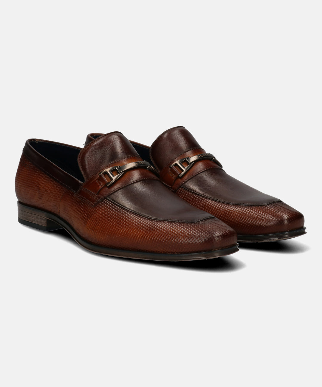 Brown leather loafers by bugatti with a textured upper, a metal strap detail and a flat sole.