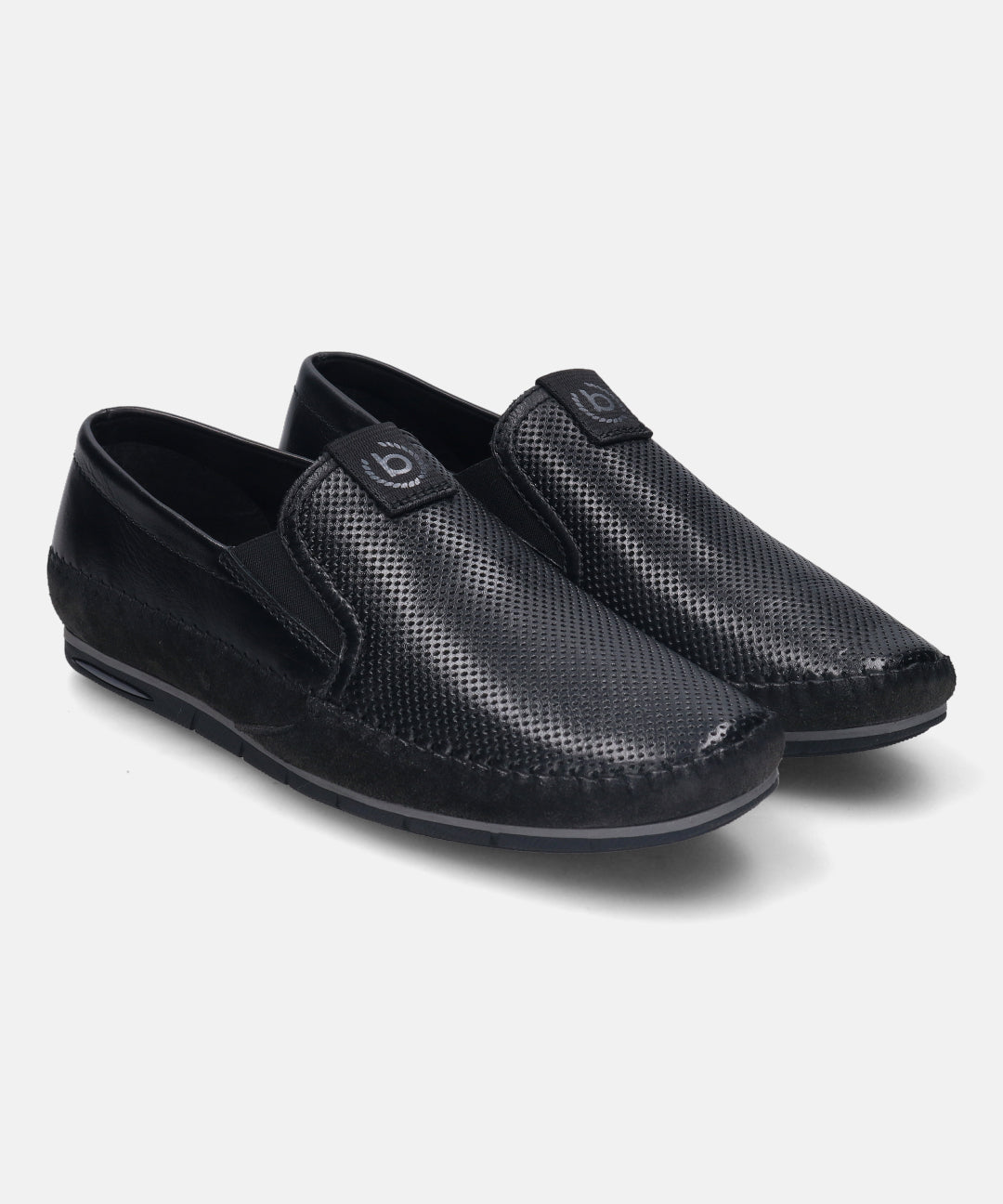 Black premium leather slip-on shoes by bugatti, featuring perforated detailing on the vamp and a subtle logo badge.