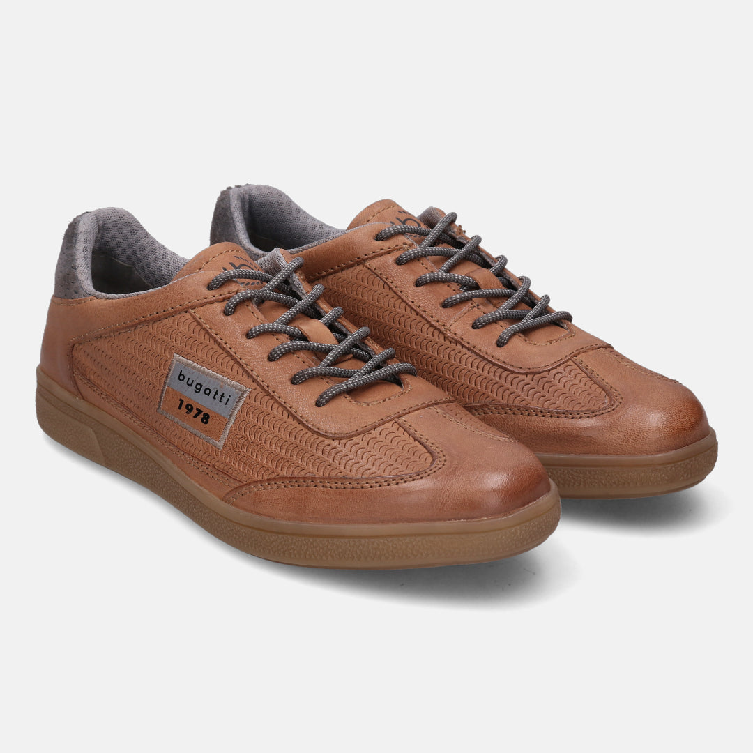 A cognac Men's bugatti  Sneakers featuring a round toe plain toe, zero heels heel, and a wide fit. Made from nubuck leather with a durable tpr outsole, this laces design offers both style and comfort.