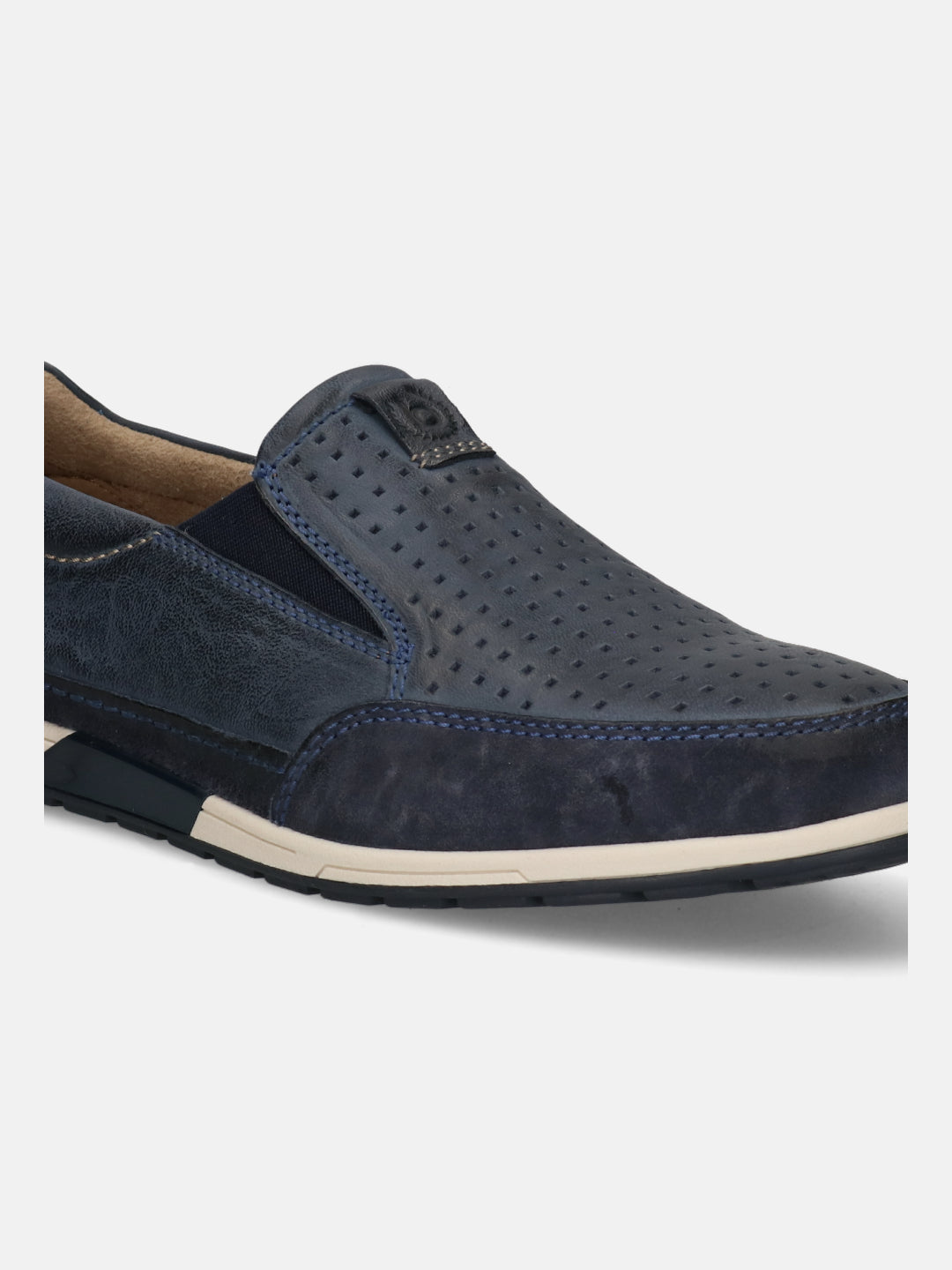 A blue Men's bugatti  Slip-On Sneakers featuring a round toe plain toe, zero heels heel. Made from nubuck leather with a durable tpr outsole, this slip-on design offers both style and comfort.