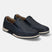 A blue Men's bugatti  Slip-On Sneakers featuring a round toe plain toe, zero heels heel. Made from nubuck leather with a durable tpr outsole, this slip-on design offers both style and comfort.