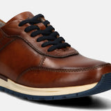 A cognac Men's bugatti  Sneakers featuring a round toe plain toe, zero heels heel. Made from premium genuine leather with a durable tpr outsole, this laces design offers both style and comfort.