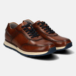 A cognac Men's bugatti  Sneakers featuring a round toe plain toe, zero heels heel. Made from premium genuine leather with a durable tpr outsole, this laces design offers both style and comfort.